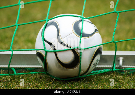 football in goal net Stock Photo