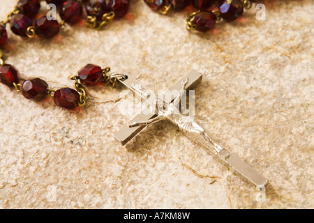 Rosary beads on a sandstone background Stock Photo