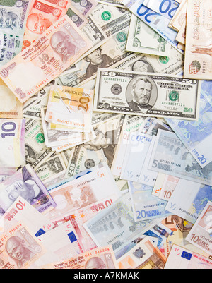 Mixed currency, including US dollars, euros, and Indian rupees. Stock Photo