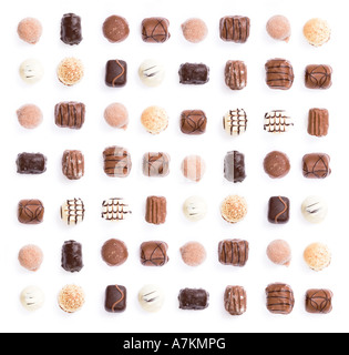 Chocolates in a uniform pattern isolated on white Stock Photo