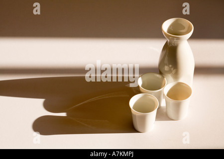 Sake jug and cups with copy space Stock Photo