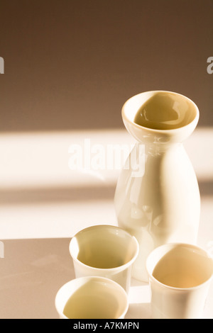 Sake jug and cups with copy space Stock Photo