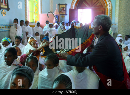 Ethiopia - offerings in an umbrella during palm sunday mass in the catholic Cathedral of the Holy Saviour - Adigrat Ethiopia Stock Photo