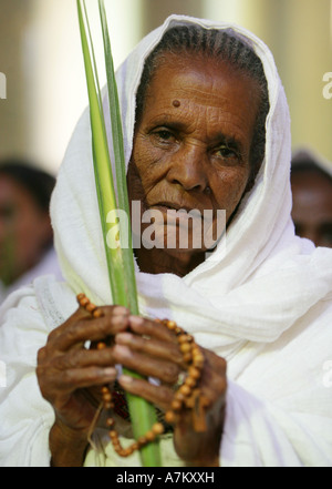 Ethiopia - woman with palm leaves given on palm sunday in the catholic Cathedral of the Holy Saviour Stock Photo