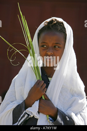 Ethiopia - girl with palm leaves given on palm sunday in the catholic Cathedral of the Holy Saviour Stock Photo