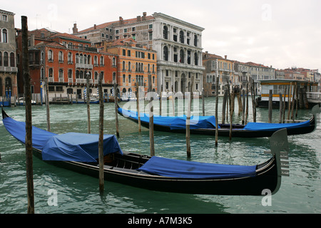 Classic evocative image of Venice with famous gondola boats on Grand Canal near Ponte di Rialto bridge Italy Europe EU Stock Photo