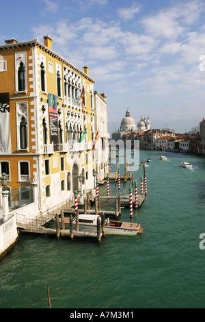 Water taxi boats cruise down the Grand Canal towards the famous Chiesa di Santa Maria della Salute Venice Italy Europe EU Stock Photo