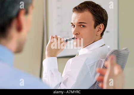 Two men sitting in the office. Stock Photo