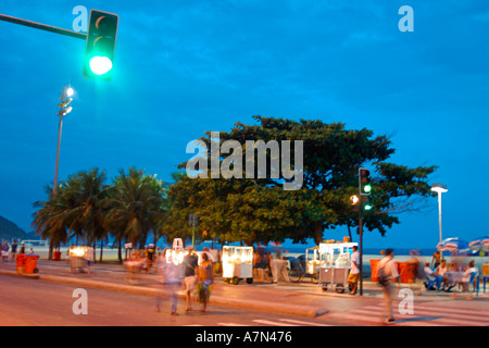 Brazil Rio de Janeiro Copacabana Promenade beach at twilight traffic light  Stock Photo