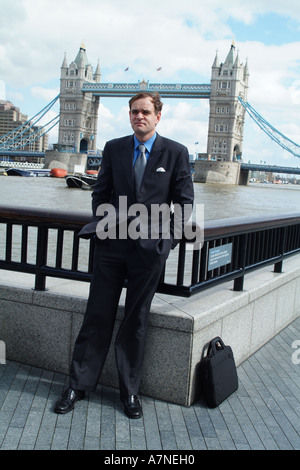 City gent on The Embankment near Tower bridge City of London England United Kingdom UK Stock Photo