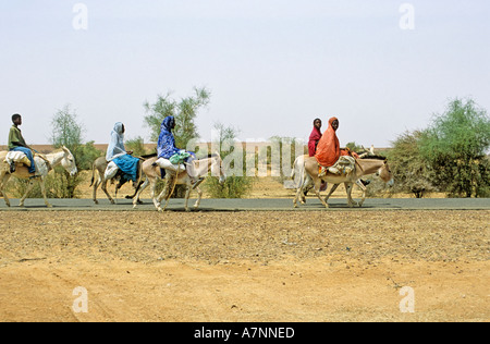 Mauritainian women on donkeys in the Sahel, Mauritania Stock Photo