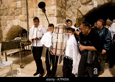 bar-mitzvah boys carrying torah scroll jerusalem israel Stock Photo