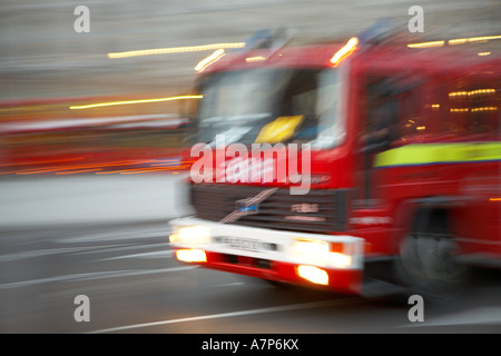 Fire engine speeding through London city England UK 15 03 2007 Stock Photo