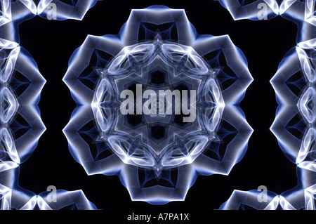 kaleidoscope kaleidoscopic pattern shapes  blue black abstract art arty horizontal design smokey beautiful subtle sublime concep Stock Photo