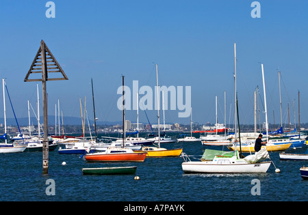 Boats moored in Port Phillip Bay, with Melbourne skyline 