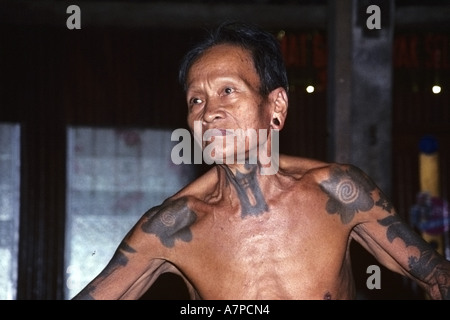 man at the longhouse Bunu of the Dayak Iban, Malaysia, Sarawak Stock Photo