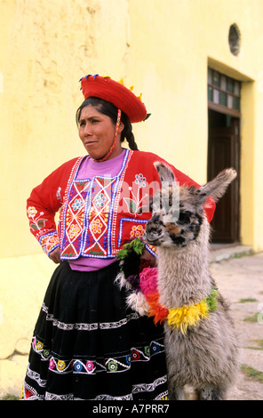 Peru, Altiplano, between Puno and Cuzco, an Indian and her son pose for photographs Stock Photo