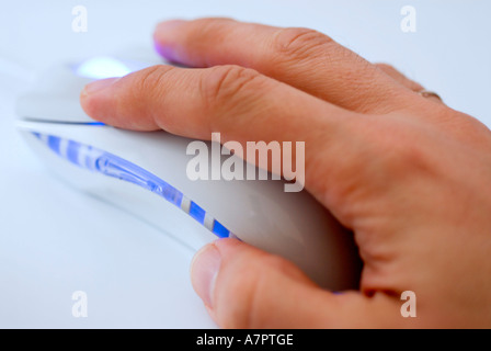 Hand on computer mouse Stock Photo