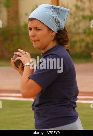 school child about to throw the shot put Stock Photo