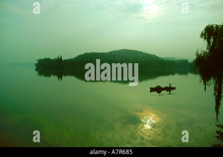 Boat on West Lake in early morning Hangchow Zhejiang District China Stock Photo