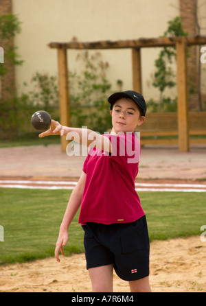 school child throwing the shot put Stock Photo