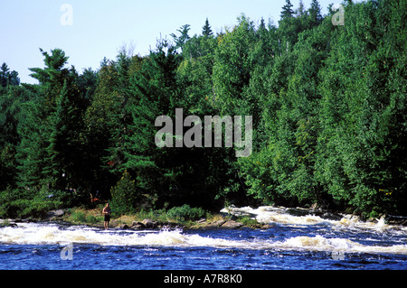 Canada, Quebec Province, La Verendrye Wildlife Reserve, the Ottawa River, fisherman on an island in the rapids Stock Photo