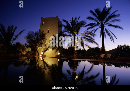 Tunisia, Southern Tunisia, Ksar Ghilane oasis, reflection of the watchtower in the swimming-pool of Ksar Ghilane hotel Stock Photo