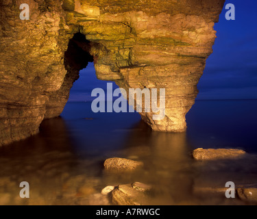 Limestone sea arch and cave at Marsden Bay on the South Tyneside coastline in the North East of England. Stock Photo