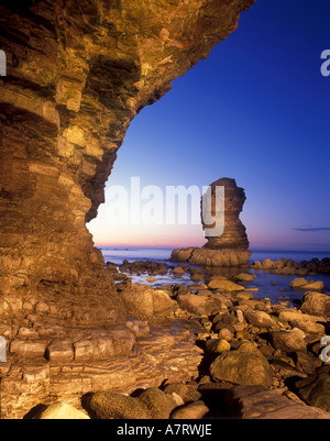 Limestone sea stack at Whitburn on the South Tyneside coastline in the North East of England. Caused by coastal erosion. Stock Photo