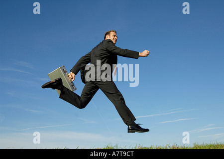 Businessman running in midair Stock Photo