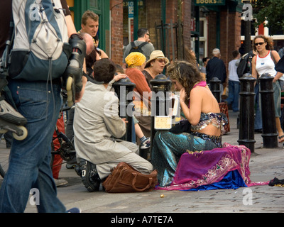 Female Street performer takes a break ,Covent Garden, London, WC2, England, GB, UK, mime, artist, miming, entertainment Stock Photo