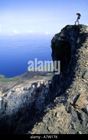 Tourist in crater of Api volcano Api island Banda islands Moluccas ...