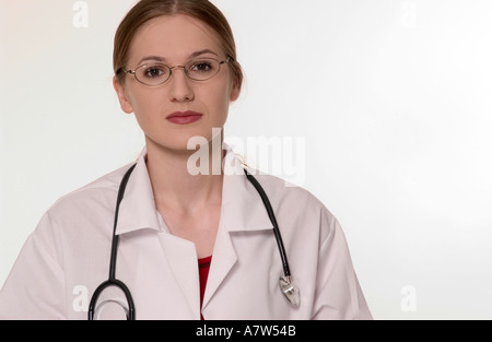 Close-up of a serious-looking Caucasian female general practitioner wearing a white coat and eyeglasses, USA. Stock Photo