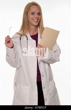 Smiling female doctor holding eyeglasses and patient file in modern clinic, USA. Stock Photo
