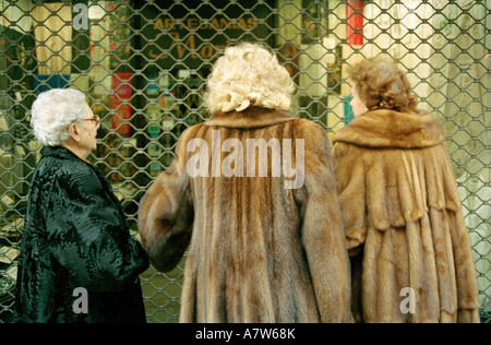 Three elderly women in Madrid wearing fur coats Stock Photo