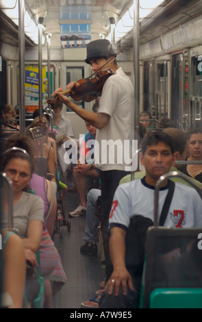 Busker on the Metro Paris Stock Photo