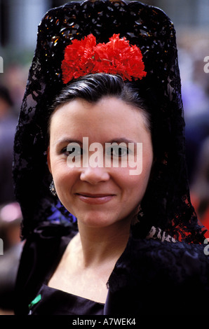 Woman wearing traditional Spanish mantilla in a Holy Week procession ...