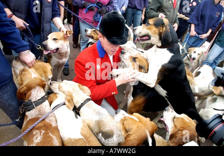 A Master of Hounds in red jacket with his dogs at pro hunting rally during the 2004 Labour Party Conference Stock Photo