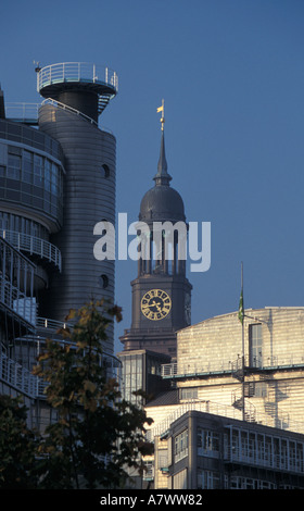 Contrast in architecture the steeple of the landmark St Michaelis Church and the modern office complex of Gruner + Jahr, Hamburg Stock Photo