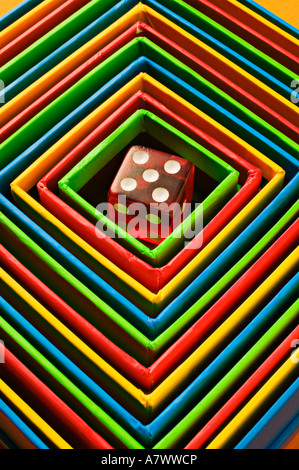 Red dice in colorful box, boxes Stock Photo