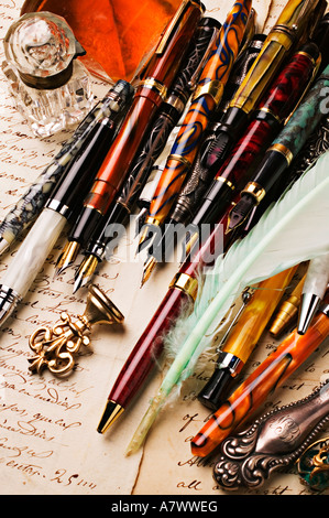 fountain pens and old letter with ink well and seal Stock Photo