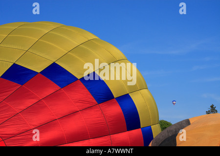 Colourful hot air balloons being prepared for flight Stock Photo