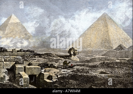 Great Pyramid and the Sphinx near Gizeh 1800s. Hand-colored woodcut Stock Photo