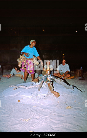 Africa, Botswana, Okavango Delta, Jacana Camp. Night time entertainment around campfire at Jacana. Stock Photo