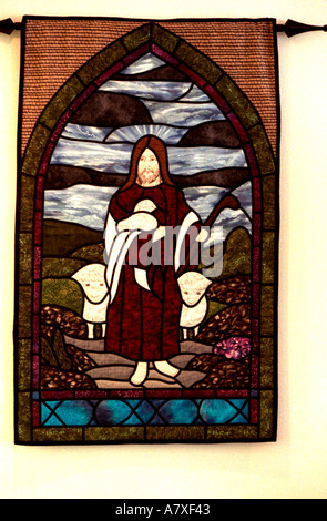 Jesus the Good Shepherd walking with sheep tapestry. St Paul Minnesota USA Stock Photo