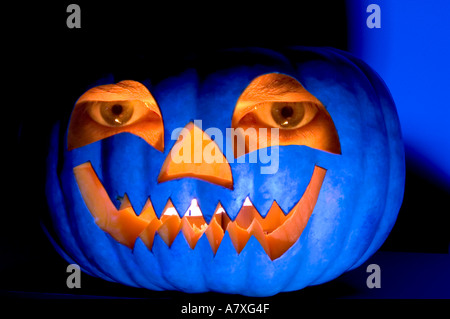 pumpkin blue eyes halloween moody scary dark dramatic orange pumpkin halloween jack o lantern moody dark scary evil halloween oc Stock Photo