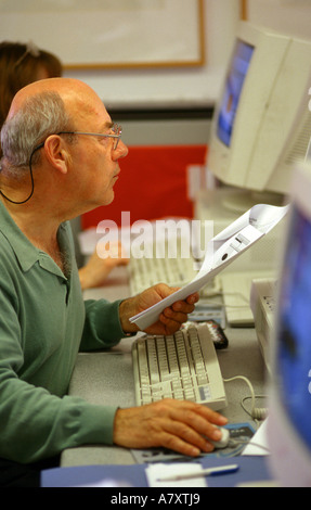 mature older man using computer Stock Photo