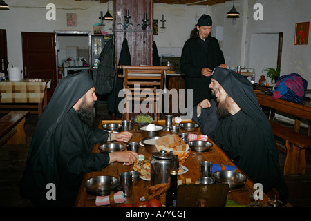 Serbian Orthodox monks and priests eat together at 14th Century Decani Monastery in Kosovo and Metohija, Serbia. Stock Photo