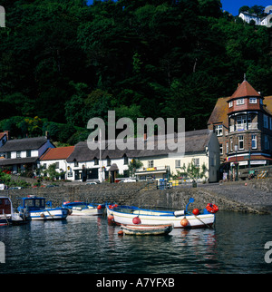 Summer panoramic view of small blue and white boats with red buoys in Lynmouth harbour North Devon England Stock Photo