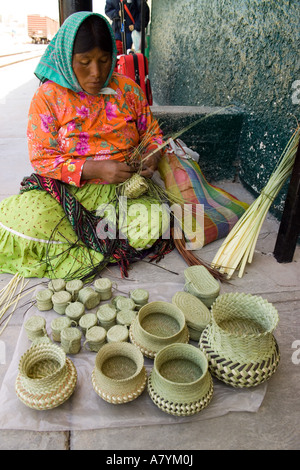 Tarahumara Indian woman weaving basket on edge of cliff of Copper ...